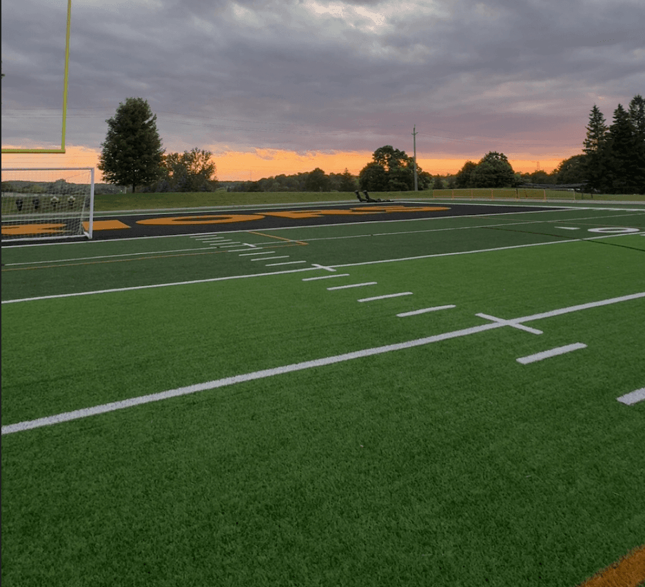 A football field at Waterloo under an evening sky